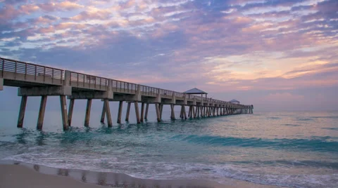 Juno Pier Time Lapse with Moving Clouds and Ocean at Beach Stock Footage 34499006