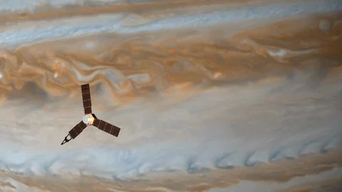 Juno's satellite flying in the orbit of Jupiter. A spinning satellite flies 스톡 동영상 124096274