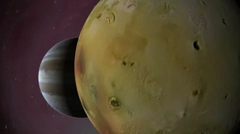 Jupiter appears from behind the volcanic moon Io Stock Footage 50563784