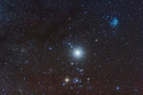 Jupiter in the constellation Taurus with deep sky objects. Stock Photos
