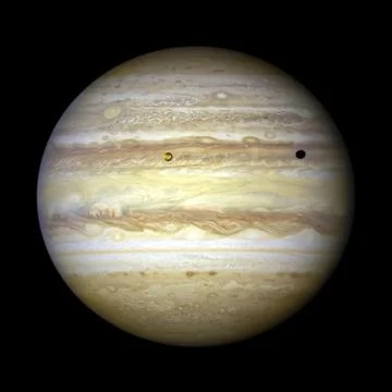 Jupiter with moon Io casting a shadow toward the planet. Stock Photos