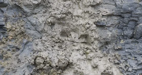 Jurassic cliffs slumping onto the beach of Charmouth in Devon. Stock Footage 302492867