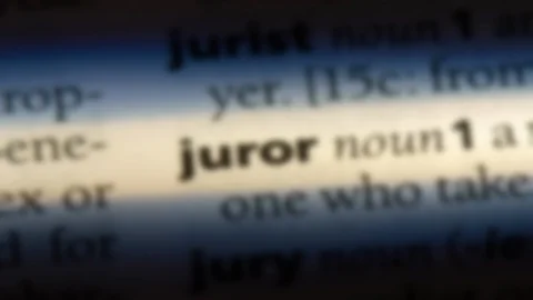 Juror word in a dictionary. Stock Footage 99561875