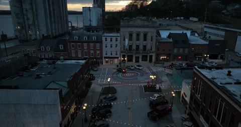 Just after sunset flying toward a brick pattern in the street intersection 動画素材 335669399