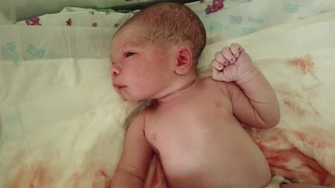 Just-born baby is crying on a table in the maternity hospital Stock Footage 156903512