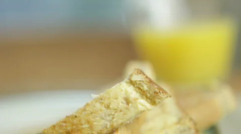 Just dunked toast in a boiled egg. Curved tracking dolly shot 库存影片 351540