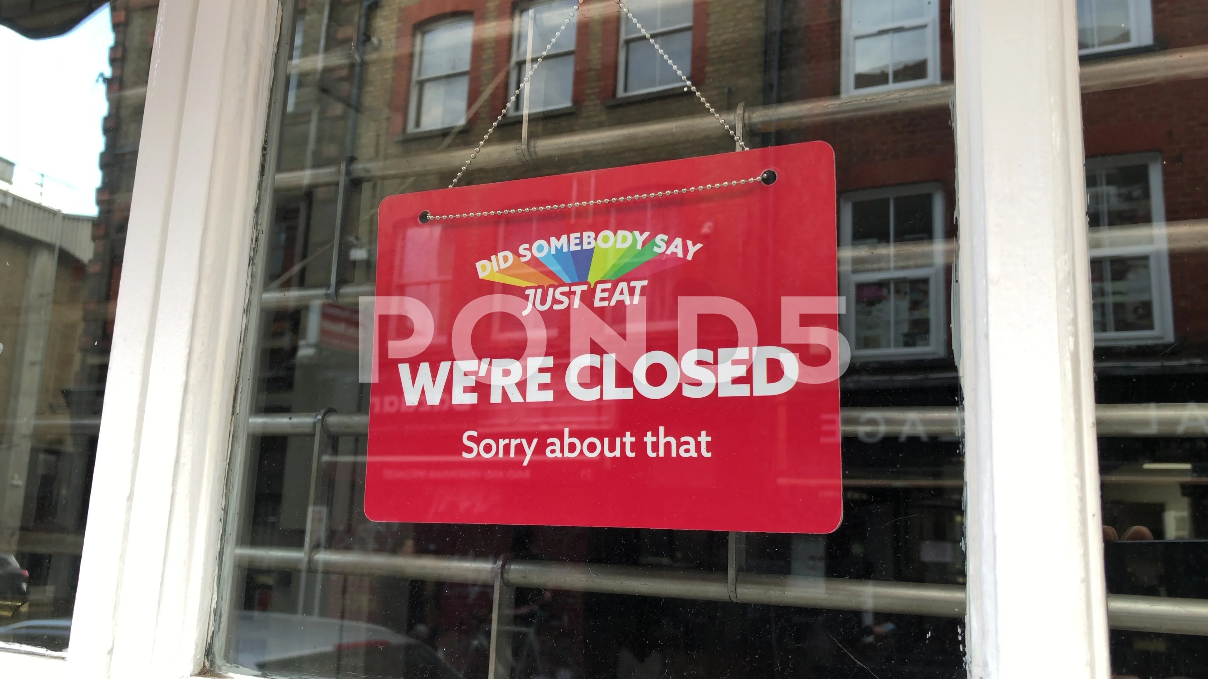 A Just Eat We re Closed sign. A Brick Lane restaurant window sign. London UK