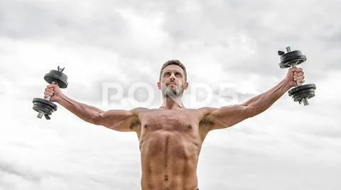 Just flying. free man sportsman weightlifting. steroids. athletic body. Dumbbell Stock Photos
