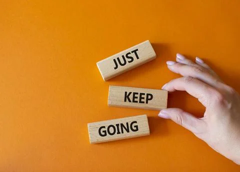 Just keep going symbol. Concept words Just keep going on wooden blocks. Bea.. Stock Photos