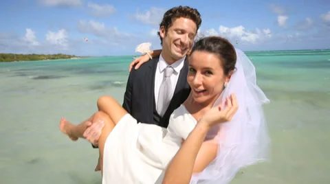 Just married couple having fun at the beach Stock Footage 38201715