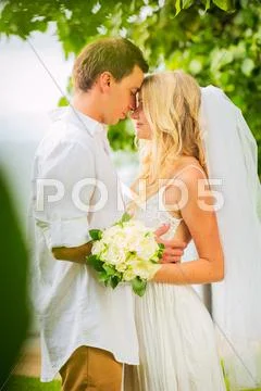 Just married couple sharing intimate moment Stock Photos