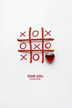Just a note. Creative valentines concept photo of noughts and crosses game... Stock Photos