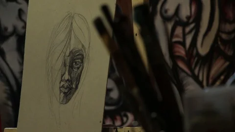 Just started painting, in the foreground brush ready to work. Video stock 105501719