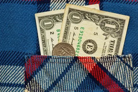 Just two dollars in work shirt pocket Stock Photos