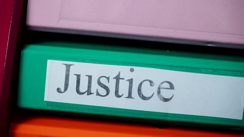 Justice binder with stack of file folder... | Stock Video | Pond5
