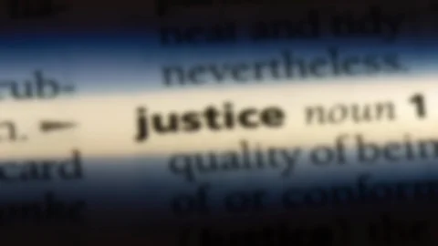 Justice word in a dictionary. Stock Footage 99561889