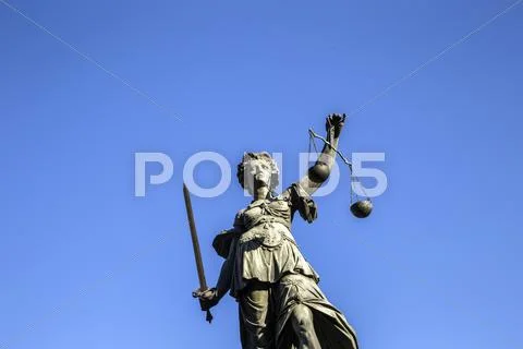 Justitia - Lady Justice sculpture on the Roemerberg square Stock Photos
