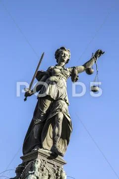 Justitia - Lady Justice sculpture on the Roemerberg square Stock Photos