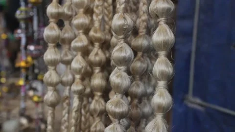 Jute made eco friendly decorative strings hung in shop Видео 331065189