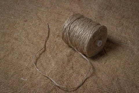 Jute thread on burlap.  Stock Photos