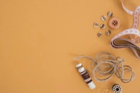 Jute thread button measuring tape spool colored background Resolution and high Stock Photos