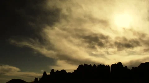 Jutting Rocks Silhouetted by Dramatic Sky Stockbeeldmateriaal 6417948