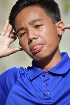 A Juvenile Making Funny Faces Foto stock