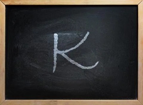 K Letter On School Board Stock Photos