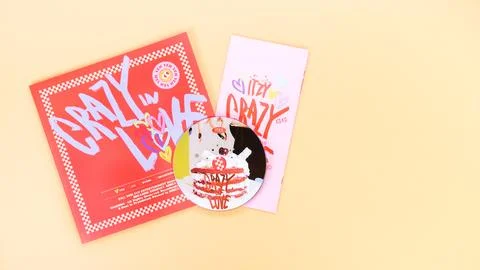 K-pop group Itzy CRAZY IN LOVE 1st Album on yellow background. Special edit.. Stock Photos