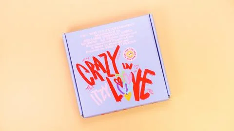 K-pop group Itzy CRAZY IN LOVE 1st Album on yellow background. Special editio Stock Photos