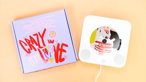 K-pop group Itzy CRAZY IN LOVE 1st Album on yellow background. Special edit.. Stock Photos