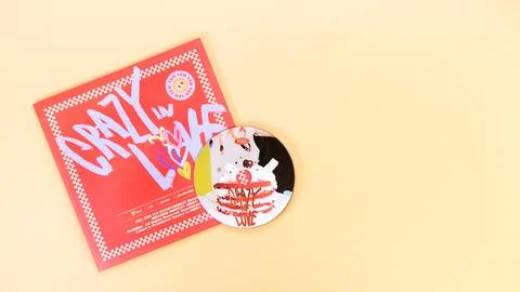 K-pop group Itzy CRAZY IN LOVE 1st Album on yellow background. Special edit.. Stock Photos