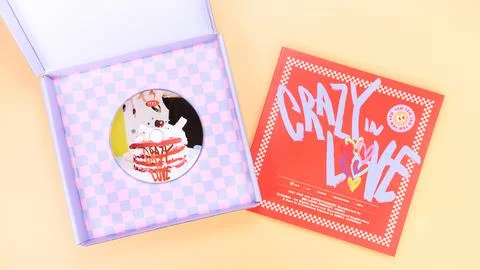 K-pop group Itzy CRAZY IN LOVE 1st Album on yellow background. Special edit.. Stock Photos