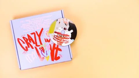 K-pop group Itzy CRAZY IN LOVE 1st Album on yellow background. Special edit.. Stock Photos