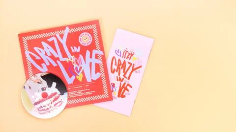 K-pop group Itzy CRAZY IN LOVE 1st Album on yellow background. Special edition Stock Photos