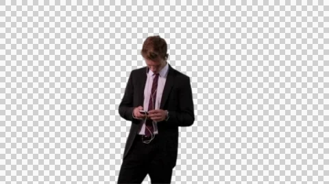 K14A8737 - Young guy in suit writes text message on his mobile phone, dances! Stock Footage 49072226