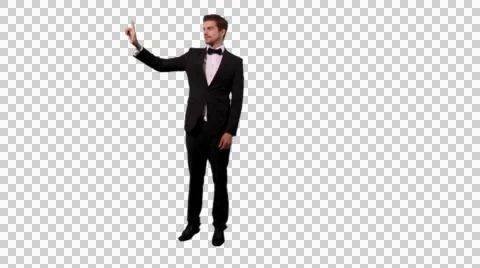 K14A8875 - Guy with tux and fly points and interacts Stock Footage 49477704