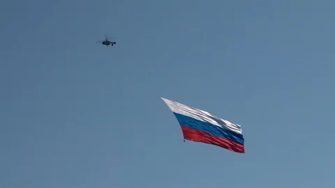 Ka-226 multi-purpose helicopter flies over Gelendzhik Bay with Russian flag. Stock Footage 121497269