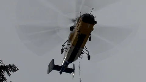 Ka-32 helicopter with cargo in hover mode. Close-up. Bottom view. Video stock 106370121