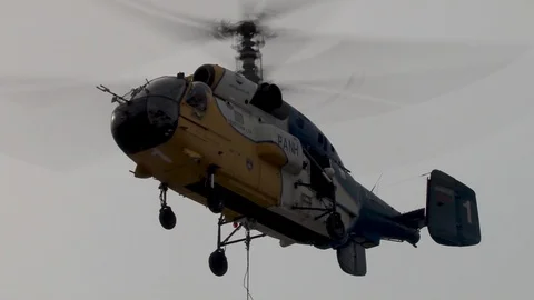 Ka-32 helicopter with external load in hovering mode.Closer-up. Stock Footage 106491479
