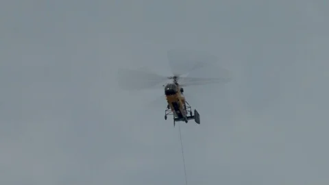 Ka-32 helicopter flies with released cable on external sling. Bottom view. Stock Footage 105842644