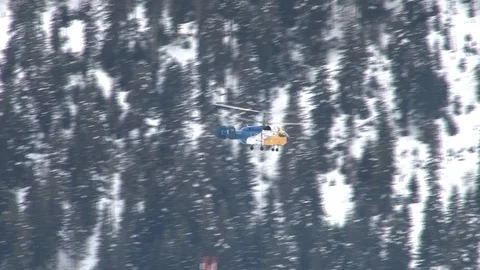 Ka-32 helicopter fly with multi-ton structure on external suspension. Stock Footage 106607433