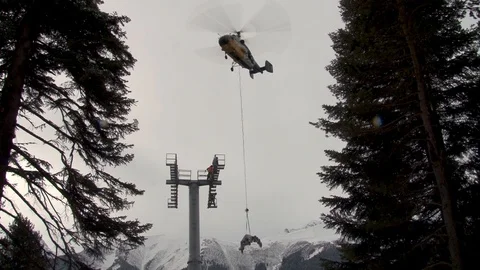 Ka-32  helicopter with the load on the rope in a slow rise vertically Stock Footage 105778208