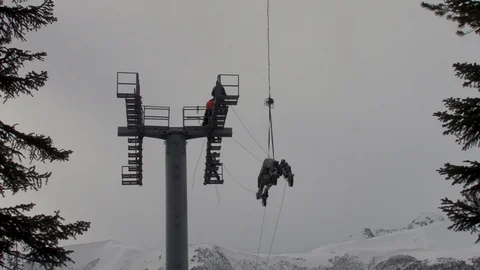 Ka-32 helicopter vertically slowly lifts a multi-ton metal structure Stock Footage 105778220