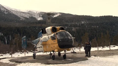 Ka-32 helicopter warms engines on helipad in mountains. Close-up. Stock Footage 105842627
