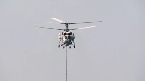 Ka-32A fire and rescue helicopter liquidates  fire in a forest Stock Footage 288605328