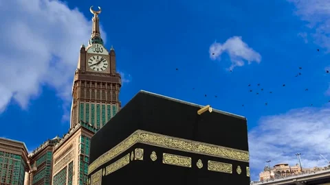Kaaba and Makkah Royal Clock Tower Under a Blue Sky in Mecca Stock Footage 344413441