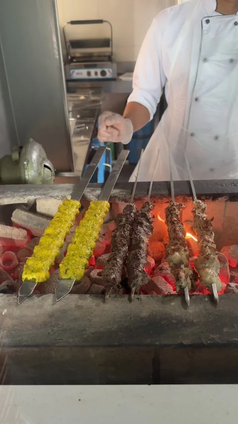 Kababs over a grill Stock Footage 306537216