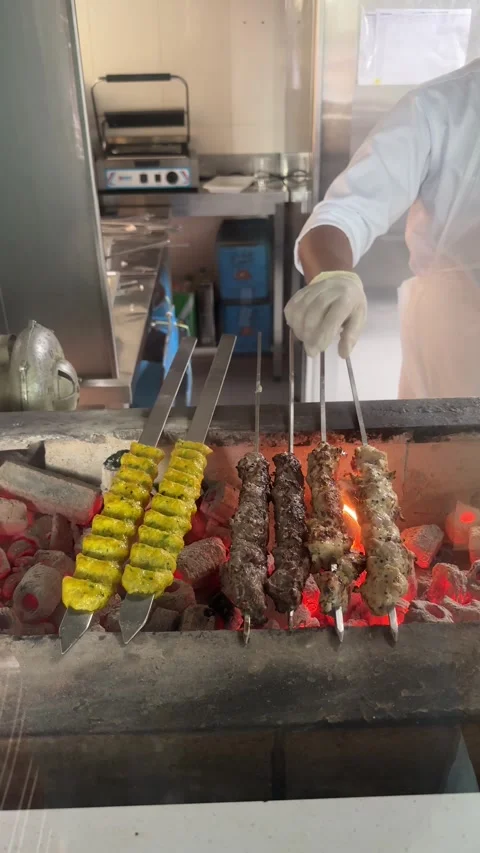 Kababs over a grill Stock Footage 306537232