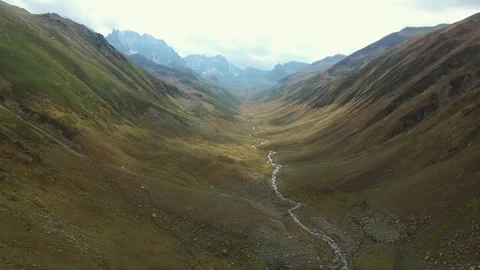 Kackar Mountains Rize Turkey U shaped valley sits below rocky - Mountain Slopes Stock Footage 339544421